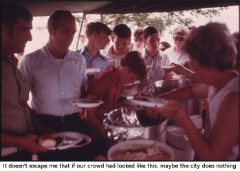 MINERS AND THEIR FAMILIES PASS THROUGH A FOOD TENT WHICH FEATURED BARBECUE AND COMPLEMENTS AT THE TENNESSEE CONSOLIDATED COAL COMPANY FIRST ANNUAL PICNIC AT THE TENNESSEE VALLEY AUTHORITY LAKE NEAR JASPER AND CHATTANOOGA, TENNESSEE. MINERS AND THEIR FAMILIES GATHERED TO TALK, PARTICIPATE IN SPORTS, WATCH A GREASED PIG CONTEST, AND HEAR ABOUT THE COMPANY'S HEALTH AND RETIREMENT BENEFITS